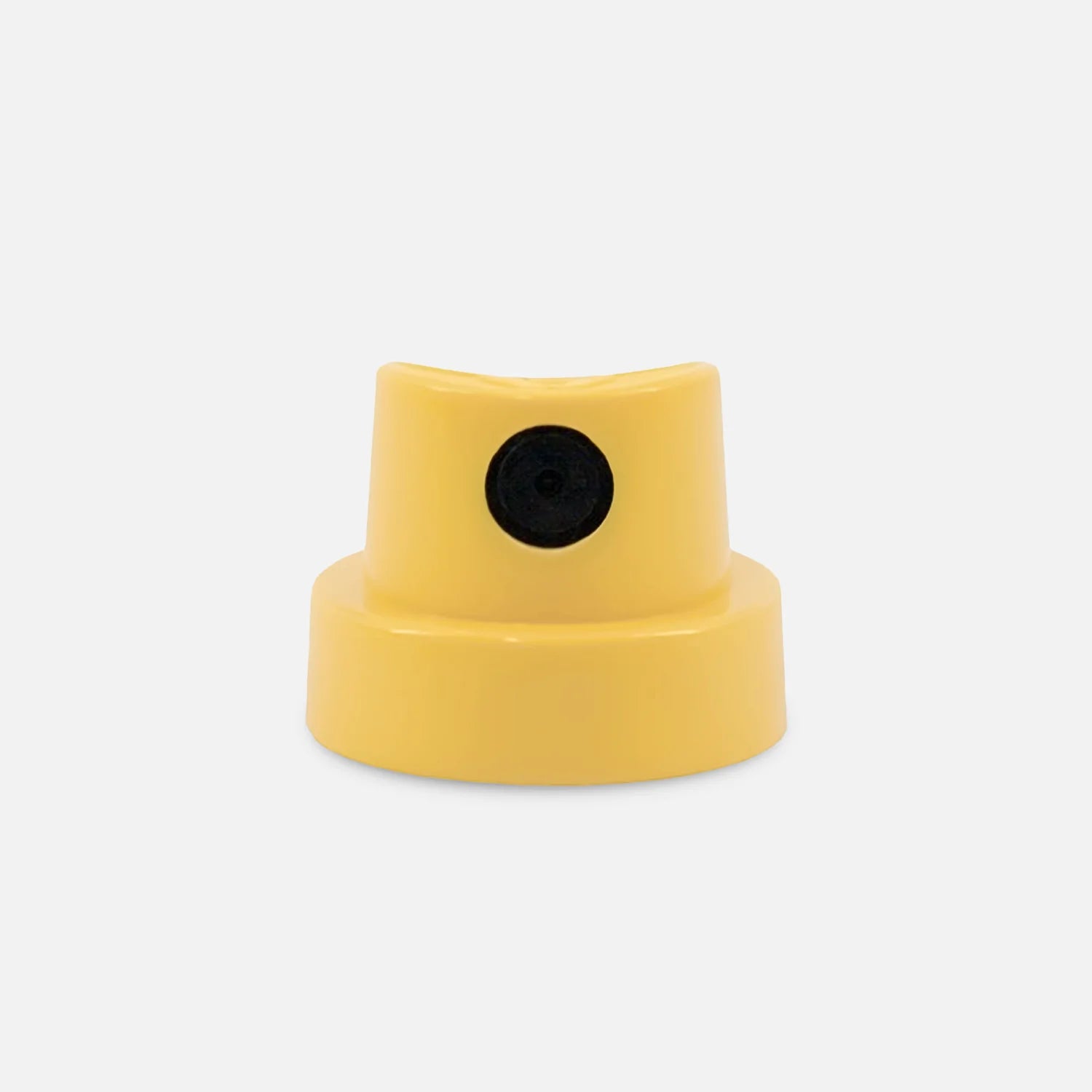 Yellow super fat cap with a black dot on a light grey background